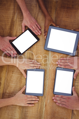 Creative team working together on a tablet and smartphones