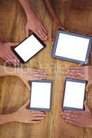 Creative team working together on a tablet and smartphones