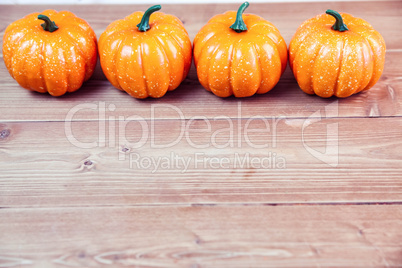 Pumpkin ornaments on desk