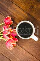 Red flowers and a cup of coffee