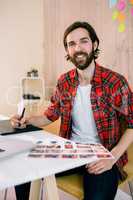 Handsome designer working at his desk