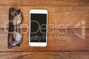 View of glasses and a smartphone