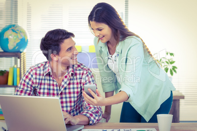 Creative team working together at desk