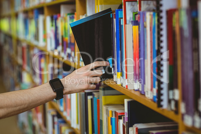 Student wearing a smart watch in library