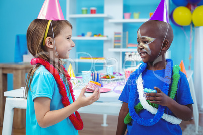 Happy kids enjoying tasty buns