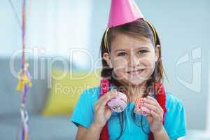 Smiling kid holding small buns