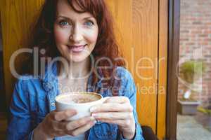 Mature student having coffee in cafe