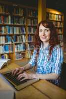 Mature student studying in library