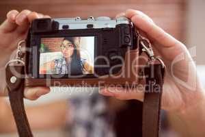 Asian woman on the couch taking selfie