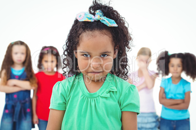 Kids standing together with girl in front