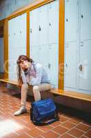 Mature student feeling stressed in hallway