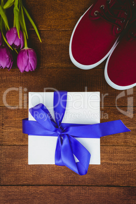 View of sneakers and blue gift