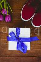 View of sneakers and blue gift