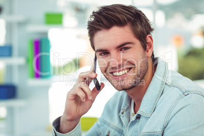 Creative businessman working on his smartphone