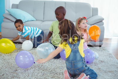 Happy kids playing with balloons