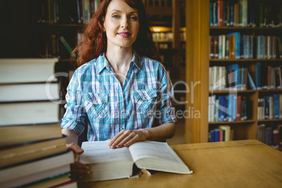 Mature student studying in library