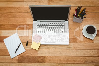 View of a grey laptop with coffee