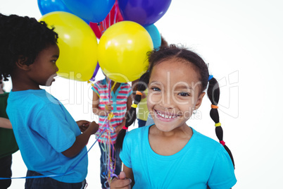 Group of kids together with balloons