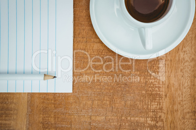 Above view of a coffee and paper Above view of a coffee and paper