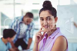 Young creative worker smiling at camera