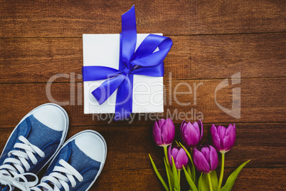 View of sneakers and blue gift