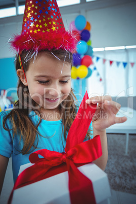 Smiling girl holding a present