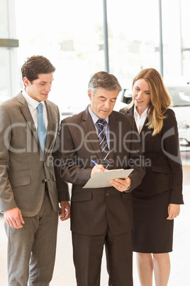 Group of smiling business team standing together