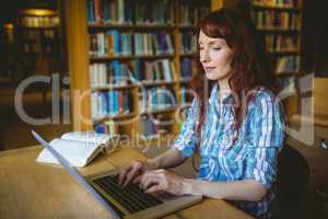 Mature student studying in library