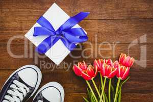 View of sneakers and blue gift