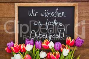 Bouquet of colored flowers against black board