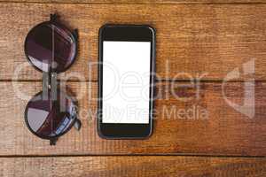 View of glasses and a smartphone