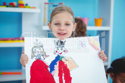 Small girl holding a lovely drawing