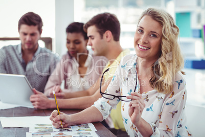 Creative business team working on a laptop together