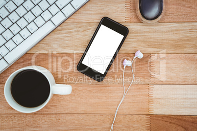 Black smartphone with cup of coffee