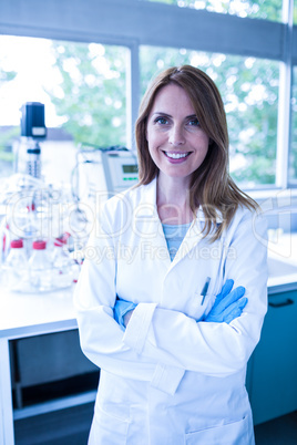 Scientist smiling at the camera in lab