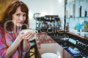 Mature student smiling in cafe