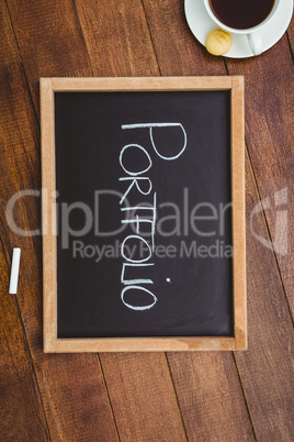 Portfolio against a big blackboard