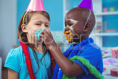 Smiling kids with icing on their faces