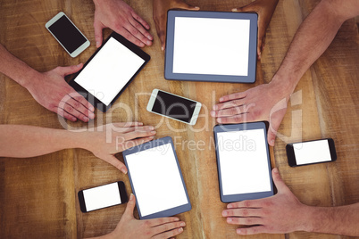 Creative team working together on a tablets and smartphones