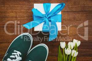 View of sneakers and blue gift