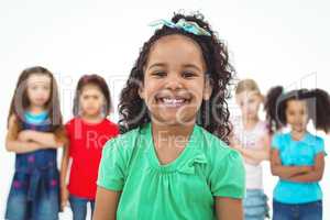 Kids standing together with girl in front