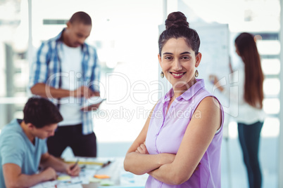 Young creative worker smiling at camera