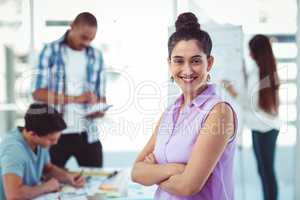 Young creative worker smiling at camera