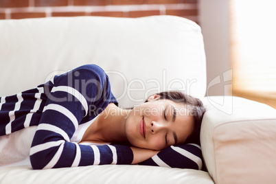 Asian woman napping on the couch