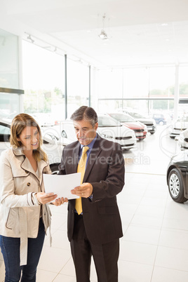 Salesman explaining the contract to a client