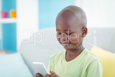 Happy boy using a smartphone