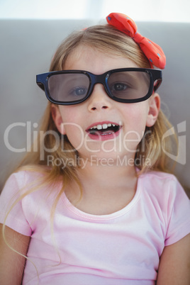 Close up of a girl wearing 3d glasses for a moive