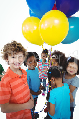 Group of kids together with balloons