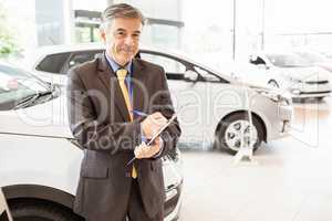 Portrait of a salesman with clipboard