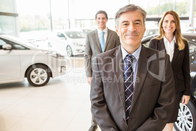 Group of smiling business team standing together